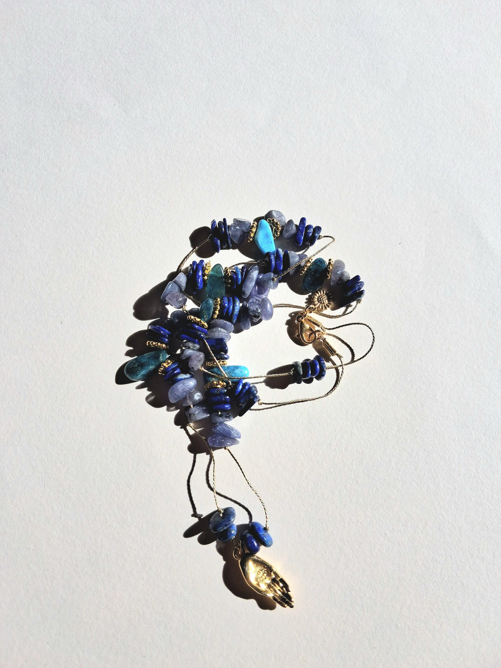 Collier signature tanzanite main (long)